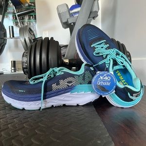 Women’s Hoka 9.5 D (wide) new never worn, with tags.